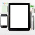 Tablet and cellphone with office supplies Royalty Free Stock Photo