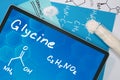 Tablet with the chemical formula of Glycine. Royalty Free Stock Photo