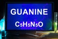 Tablet with chemical formula of guanine.