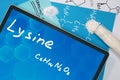 Tablet with the chemical formula of Lysine . Royalty Free Stock Photo