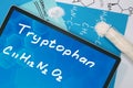 Tablet with the chemical formula of Tryptophan .