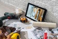 Tablet computer with architecture and construction tools and blueprints Royalty Free Stock Photo