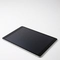 Tablet computer with black screen on white background. Isolated front view Royalty Free Stock Photo