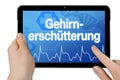 Tablet computer with the german word for concussion - Gehirnerschtterung Royalty Free Stock Photo
