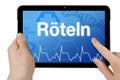 Tablet computer with the german word for rubella - Roeteln Royalty Free Stock Photo