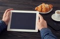 Tablet computer in the hands of man with blank screen Royalty Free Stock Photo