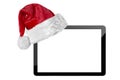 a tablet computer isolated with a Santa Claus hat for Christmas on the white backgrounds Royalty Free Stock Photo