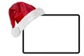 a tablet computer isolated with a Santa Claus hat for Christmas on the white backgrounds Royalty Free Stock Photo