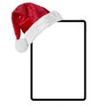 a tablet computer isolated with a Santa Claus hat for Christmas on the white backgrounds Royalty Free Stock Photo