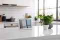 A tablet computer placed on a kitchen counter. Ideal for showcasing technology in a modern kitchen setting Royalty Free Stock Photo