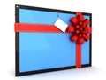 Tablet computer with a red ribbon for gift.
