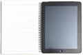 Tablet computer and ring paper note book on whitebackground in u Royalty Free Stock Photo