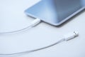 Tablet computer with USB cable Royalty Free Stock Photo