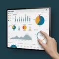 Tablet displaying app analytics interface with various graphs and charts. Includes bar Royalty Free Stock Photo