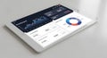 A tablet displaying a modern business dashboard with financial data and graphs Royalty Free Stock Photo