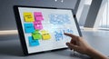 Tablet displaying sticky notes and charts, hand interacting with data visualization Royalty Free Stock Photo