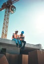 Tablet, engineer and talking on building roof at construction site for vision, development or architecture. Black woman Royalty Free Stock Photo