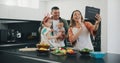 Tablet, family smile and video call while cooking, happy and internet on technology, communication and greeting. Parents Royalty Free Stock Photo