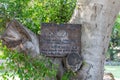 A tablet in the garden of the Church of the Primacy of Saint Peter narrating that mountain hares - rock hyrax were mentioned three