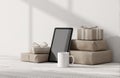 Tablet with Gift Boxes and Mug on Light Desk Royalty Free Stock Photo