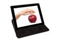 Tablet with the hand and a red apple the screen Royalty Free Stock Photo