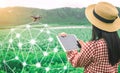 Tablet in the hands of farmers technology drones to control agricultural