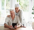 Tablet, happy old couple and online in home with social media, reading news app and ebook. Retirement, senior man and Royalty Free Stock Photo