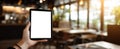 The tablet held in a relaxed cafe setting, perfect for showcasing digital content. AI generated image Royalty Free Stock Photo