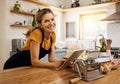 Tablet, kitchen and senior woman cooking recipe from website blog for home lunch, dinner or food and wine. Digital Royalty Free Stock Photo