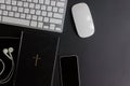 Tablet, laptop, mouse and Bible on the dark background Royalty Free Stock Photo