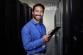 Tablet, man and portrait in server room of engineer programming at night. Information technology, face and happy Asian Royalty Free Stock Photo