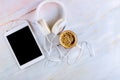 Tablet on marble background with headphone and cup of coffee espresso Royalty Free Stock Photo