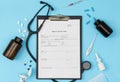 A tablet with a medical history form on a blue background. Medical diagnosis of a doctor's prescription. Royalty Free Stock Photo