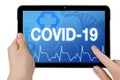 Tablet with medical touchscreen and diagnosis corona-virus Covid-19