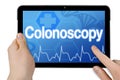 Tablet with medical touchscreen and term colonoscopy isolated Royalty Free Stock Photo