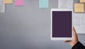 Tablet Mockup Image. Display Screen is Clipping Path. Modern Businesman Using Tablet in Office. Blurred Sticky Note and Project