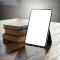 Tablet Mockup with Stack of Books on Wooden Table Royalty Free Stock Photo