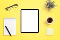 Tablet mockup on yellow office desk. Isolated screen for app or web site design promotion