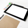 Tablet with office supplies Royalty Free Stock Photo