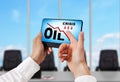 Tablet with oil crisis chart Royalty Free Stock Photo