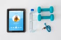 Tablet pc, dumbbells, whistle and water bottle Royalty Free Stock Photo