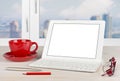 Tablet PC with keyboard and red mug on office table Royalty Free Stock Photo