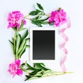 Tablet and pink flowers