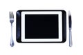 Tablet on a plate fork knife recipe Royalty Free Stock Photo