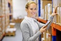Tablet, portrait or happy woman in warehouse for shipping delivery, box shelf and stock in factory for storage. Printing Royalty Free Stock Photo