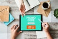 Tablet with promo code field on screen. E-commerce, mobile marketing concept. Royalty Free Stock Photo