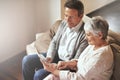 Tablet, relax or old couple streaming movies or film on online subscription in retirement at home together. Love