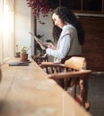 Tablet, remote work and coffee shop with business woman doing digital work at cafe. Restaurant reading, email and typing Royalty Free Stock Photo