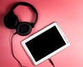 Tablet Screen for Music application with headphone Royalty Free Stock Photo