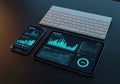 Tablet and smartphone displaying graphical data charts and Royalty Free Stock Photo